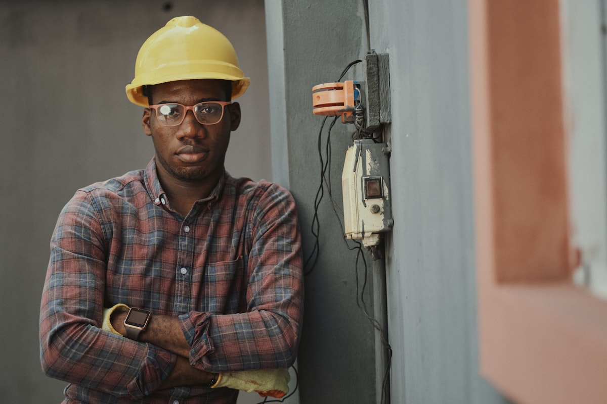 Construction worker in hard hat at a job site, representing injured workers seeking compensation